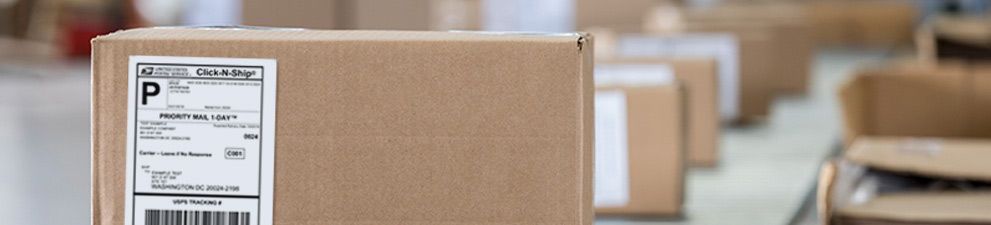 USPS package on a conveyor belt.