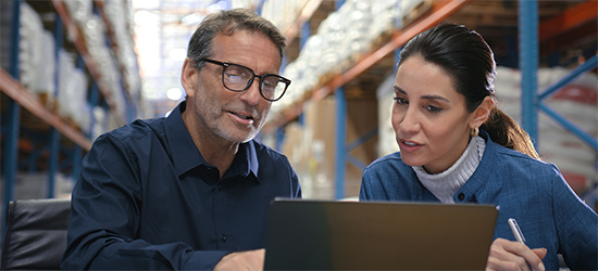 Customer taping a box to prepare for shipping.
