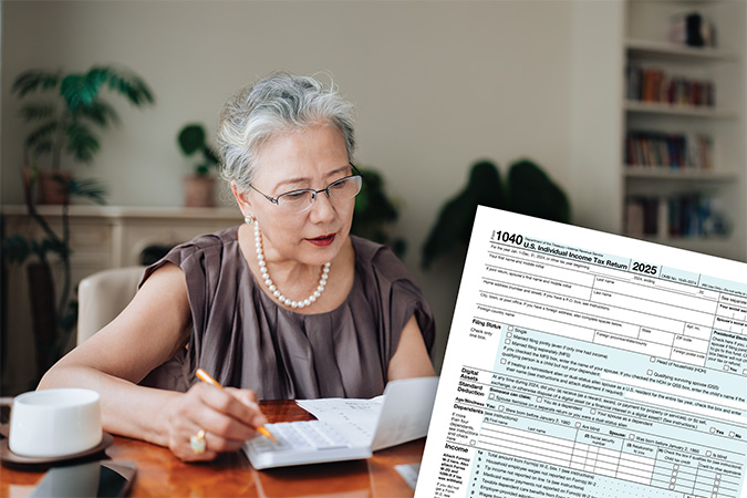 An IRS form 1040 and a person filling out a form.