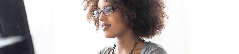 Image of a person typing on a computer.