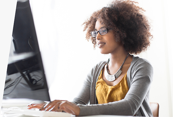 Image of a person typing on a computer.